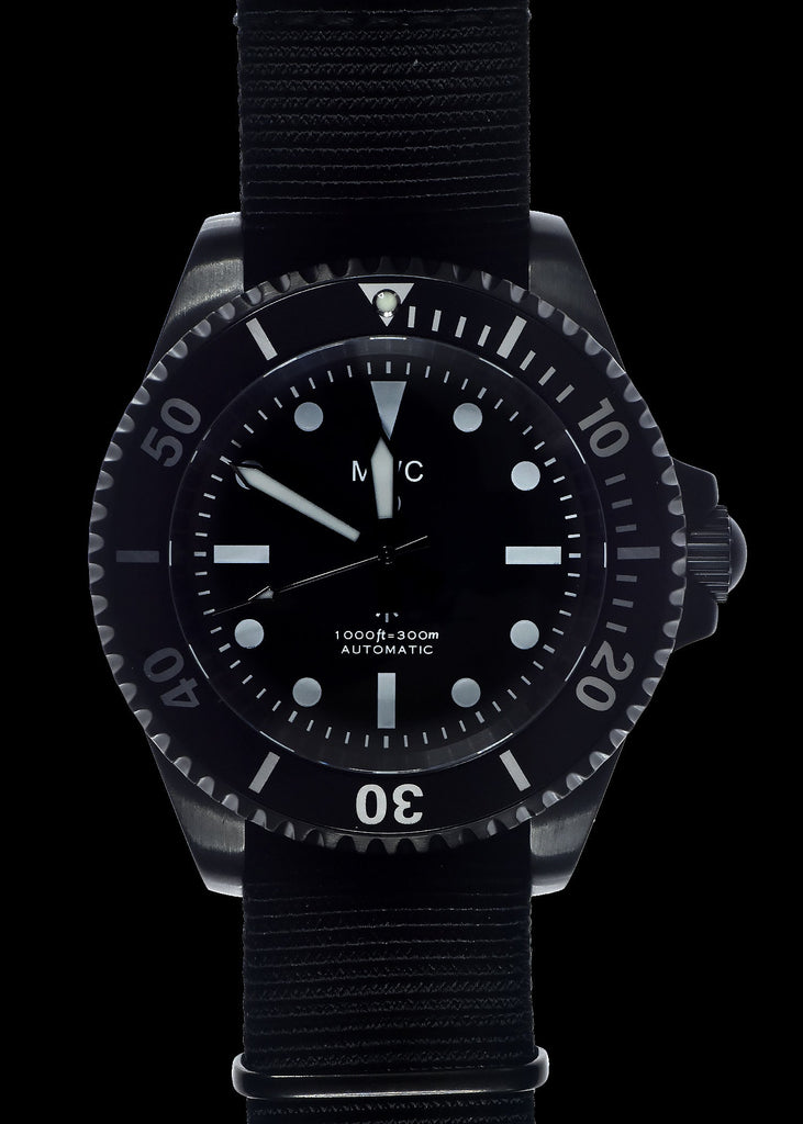 MWC 24 Jewel 1982 Pattern 300m Automatic Military Divers Watch in Black PVD with a Sapphire Crystal on a NATO Webbing Strap (Non Date Version)